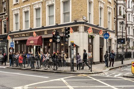 London / UK - Nov 28, 2019: Chinese tourists near Yangs Palace restaurant on Bloomsbury Way in Holborn, Londonのeditorial素材
