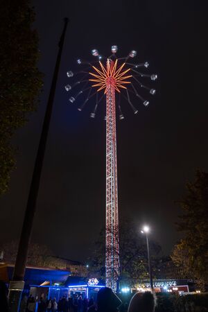 London / UK - Nov 24, 2019: swing ride on the Christmas Market on the South Bank of the the River Thames, London. Motion blur, selective focusのeditorial素材