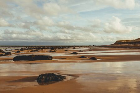 Scenic view of the beach at the North Sea side in Brora village in Scotland, UKの写真素材