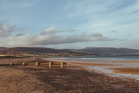 The pipeline on the shore of the North Sea dropping water from the nearest village in Scotland, UKの写真素材