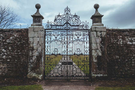 Wrought iron gate of the Dunrobin Castle in the Highland area of Scotland, looking at the Moray Firth a roughly triangular inlet of the North Seaのeditorial素材