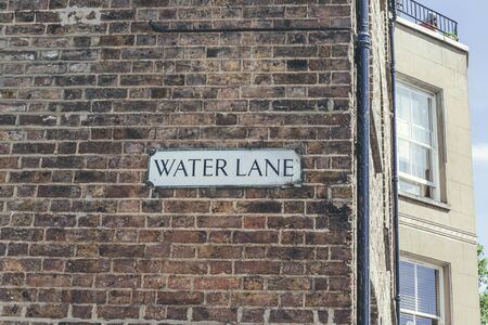 Water Lane name sign on a brick wall in Richmond part of the London Borough of Richmond upon Thames, UKの写真素材