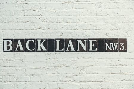 Back Lane street name sign, Hampstead. Hampstead is known for its intellectual, liberal, artistic,...