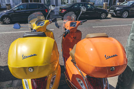 London/UK-1/08/18: Colorful Vespa scooters, that have been known for their painted pressed steel unibody which combines a complete cowling for the engine, flat floorboard, and prominent front fairingのeditorial素材
