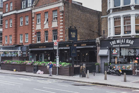 London/UK - 30/07/18: The Black Lion Pub on West End Lane in West Hampstead. Pubs are a social drinking establishment and a prominent part of British cultureのeditorial素材