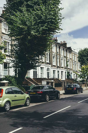 London/UK-30/07/18: a row of typical British Georgian terrace houses. Terrace house is a form of medium-density housing that originated in Europe, whereby a row of attached dwellings share side wallsのeditorial素材