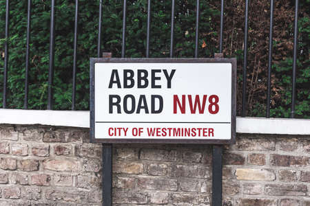 London/UK-30/07/18: Abbey Road name sign, the City of Westminster, London. This road is best known for the Abbey Road Studios and for being the namesake of the 1969 album by the Beatlesのeditorial素材