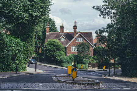 London/UK-30/7/18: red brick Georgian style house on the crescent of Lyndhurst and Akenside Roads in Hampstead. Hampstead has some of the most expensive housing in the London areaのeditorial素材