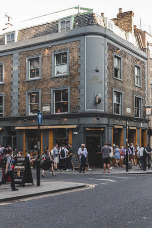 London/UK-26/07/18: people socializing just outside The Fellow Pub on York Way near King's Cross....