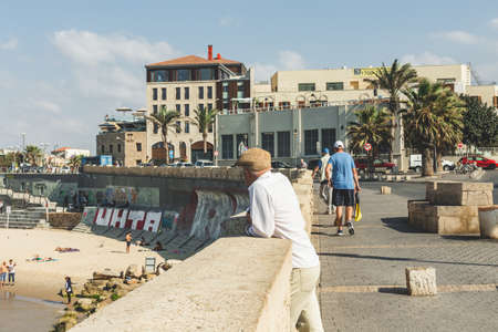 Tel Aviv/Israel-10/10/18: tourists walking along the promenade in Tel Aviv on a sunny summer dayのeditorial素材