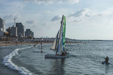 Tel Aviv/Israel-10/10/18: Hobie 16 catamaran on the Mediterranean beach in Tel Aviv. Hobie 16 is a popular catamaran manufactured by the Hobie Cat Company for racing and day sailingのeditorial素材
