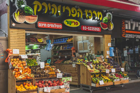Tel Aviv/Israel-12/10/18: Fresh fruits and vegetables in wooden crates on sale at a local market on Dizengoff Street in Tel Avivのeditorial素材