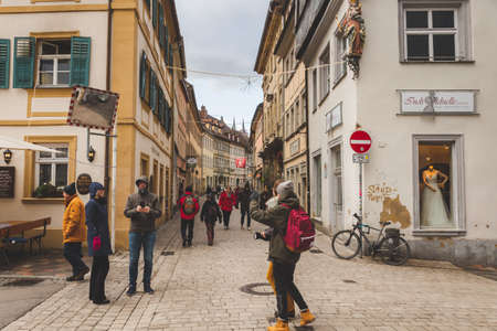 Bamberg/Germany-2/1/19: people walking on a street in the downtown of Bamberg on a cold day. Bamberg is a town in Upper Franconia, on the river Regnitz close to its confluence with the river Mainのeditorial素材