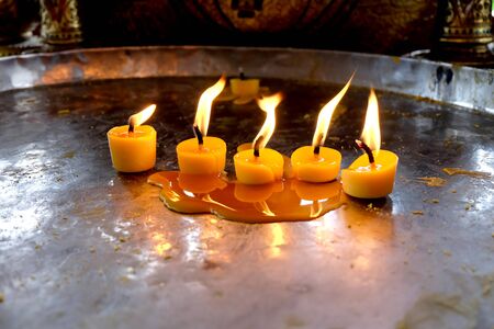 Many candles on a tray