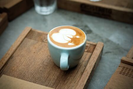 Hot coffee on a tray on the table.