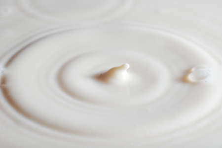 pouring milk splashの写真素材