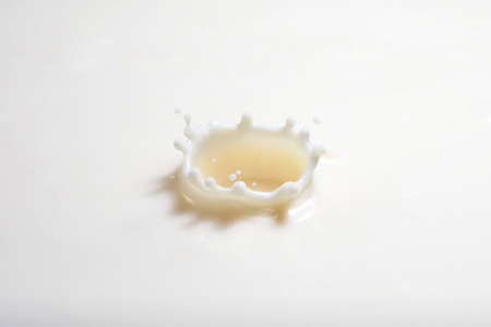 pouring milk splashの写真素材