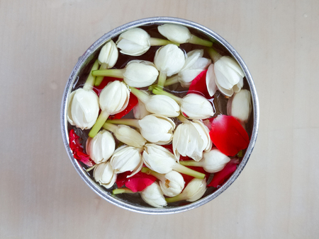Jasmine and roses in silver bowl ,Songkran festival in Thailand.の写真素材