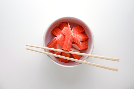 Imitation Crab Stick on a plate on white background, Japanese foodの写真素材