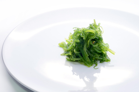 Hiyashi Wakame Chuka or seaweed salad in dish on white background , Japanese foodの写真素材
