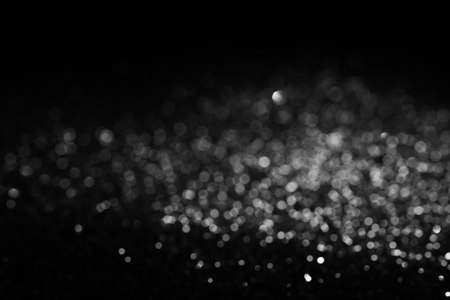 Black and white or silver Glitter and elegant on black background for Christmas or Decoration ,background textureの写真素材