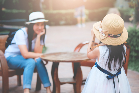 Traveling girls photograph happy mothers. On vacation with her family.の写真素材