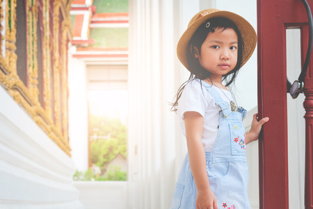 Asian girl standing on the balcony terrace in the templeの写真素材