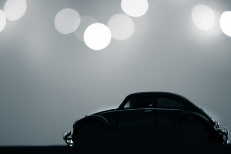 Nonthaburi, Thailand - July 15, 2017: Volkswagen beetle car toy vintage style in the dark with bokeh...