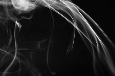 Abstract beautiful smoke on a black backgroundの写真素材
