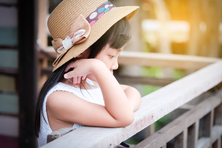 Asian child girl in a lonely mood, depressed and anxiousの写真素材