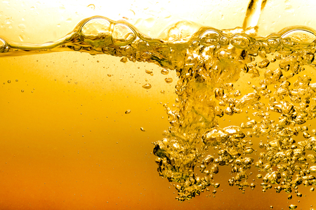 Bubbles in Water Oil beer gold Beautiful abstract backgroundの写真素材