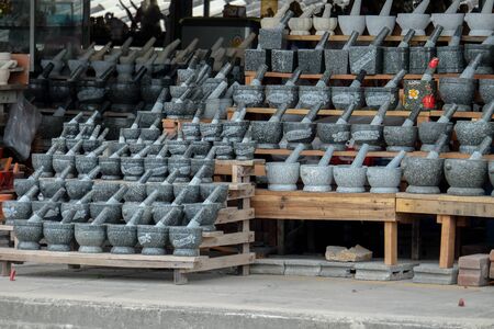 Chonburi, Thailand - November 5, 2017: A storehouse filled with mortar stones made of granite. The...