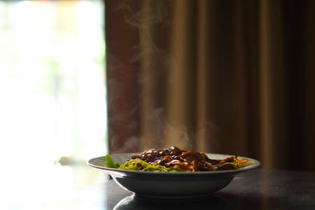Grilled duck noodle menu is on the plate on the breakfast table.の写真素材