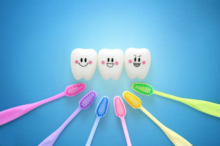 Toys teeth dental in a smiling mood with tooth brush colorful on blue background, With Clipping pathの写真素材