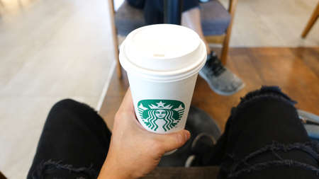 Pathum Thani, Thailand - September 20, 2018 Starbuck hot coffee in a glass of white paper venti size...