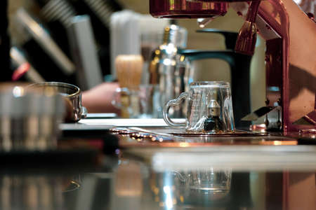 The clear glass is placed on the coffee maker in the fresh coffee shop