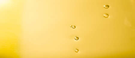 Liquid gold drop and ripple ,abstract backgroundの写真素材