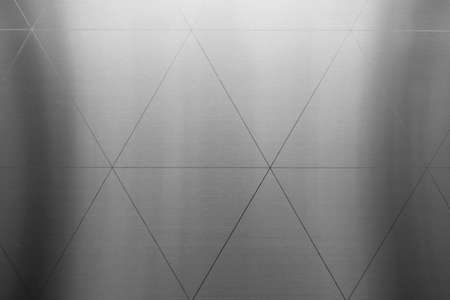 Silver or aluminum  triangle shiny wall abstract background texture, Beatiful Luxury and Elegantの写真素材