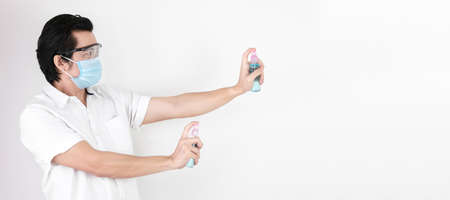 Asian man on a white background are strengthening to overcome the virus by wearing a mask and...