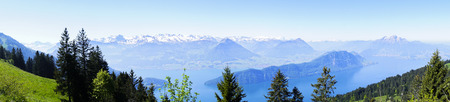 panoramic view of the snow mountain from to top of Riki Kulm Switzerlandの写真素材