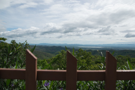 Beautiful view landscape on the top of mountain in Phayao Province , Thailand.The wall defend for tourist or visitor don't walk through.The freedom behind the wall.の写真素材