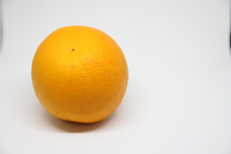 One fresh orange on whiteの写真素材