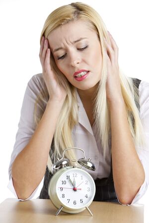 portrait of businesswoman with an alarm clockの写真素材