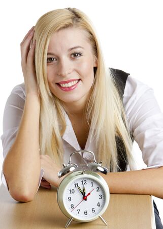 portrait of businesswoman with an alarm clockの写真素材