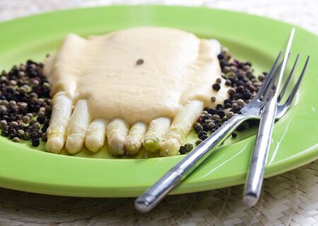 white asparagus with pepper and cheese sauceの写真素材
