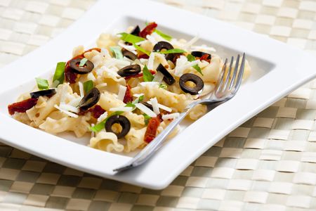 pasta with dried tomatoes and olivesの写真素材