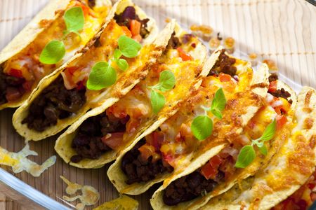 baked tacos with tomatoes and minced meatの写真素材