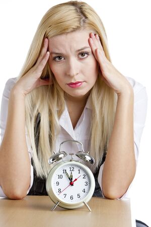 portrait of businesswoman with an alarm clockの写真素材
