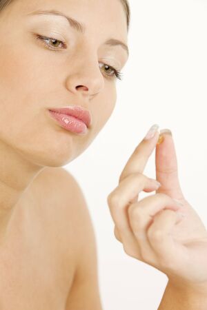 portrait of woman with vitamin Eの写真素材