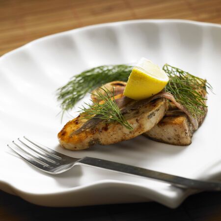 swordfish steak with anchoviesの写真素材